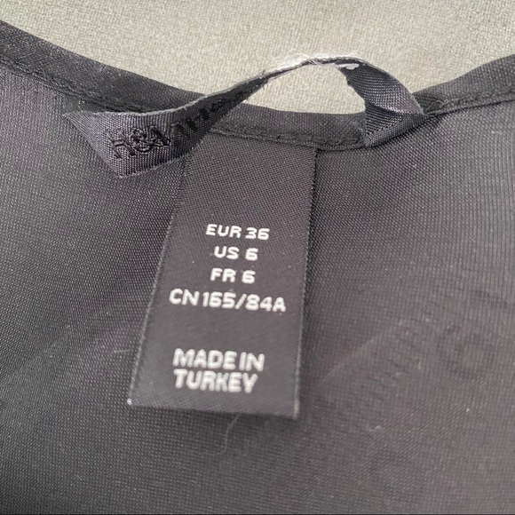 Black ruffle front sleeveless blouse - Picture 4 of 5